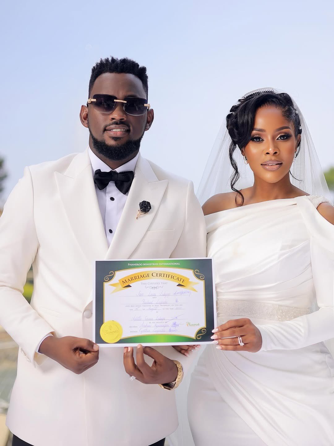 It’s official — gospel power couple Levixone and Desire Luzinda are now husband and wife! The two tied the knot today in a beautiful and intimate wedding that gathered only close family and a handful of friends.

The wedding is the grand finale of their long run of celebrations — from the engagement, the bridal shower, the kwanjula — all roads finally led to the altar.

The ceremony was presided over by Apostle Grace Lubega of Phaneroo Ministries at the scenic Serena Kigo Fountain Area, which added an extra glow to the day. Desire’s sister stepped in as matron of honour, while Levixone was flanked by his best man, media personality Andrew Kyamagero.

After the vows, the couple treated their guests to a classy reception filled with food, music, speeches, dance and all the good vibes you’d expect at a Ugandan celebrity wedding.

Levixone and Desire Luzinda Wedding Photos